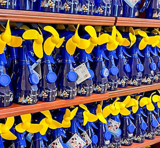 A row of blue and yellow bottles in a store.