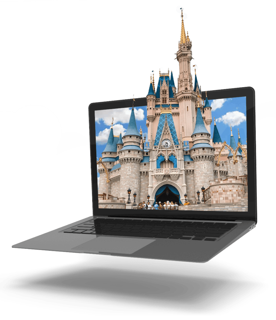 A laptop with a disney castle on it.