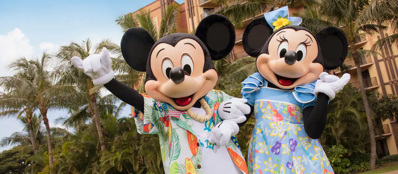 Mickey Mouse and Minnie Mouse in hawaiian attire.