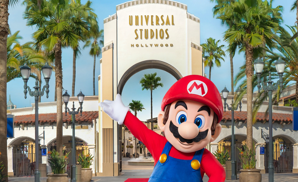 Mario from Nintendo is standing in front of universal studios hollywood